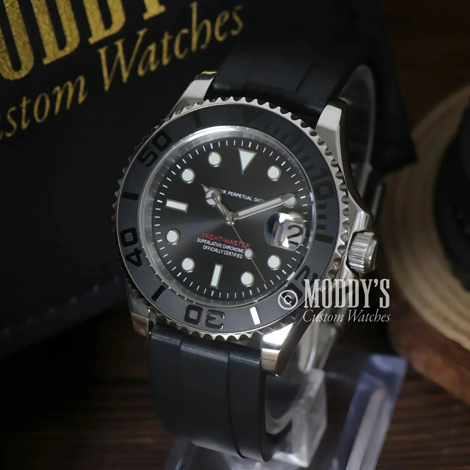 Black-faced Seikomariner wristwatch with black band and NH35 automatic movement