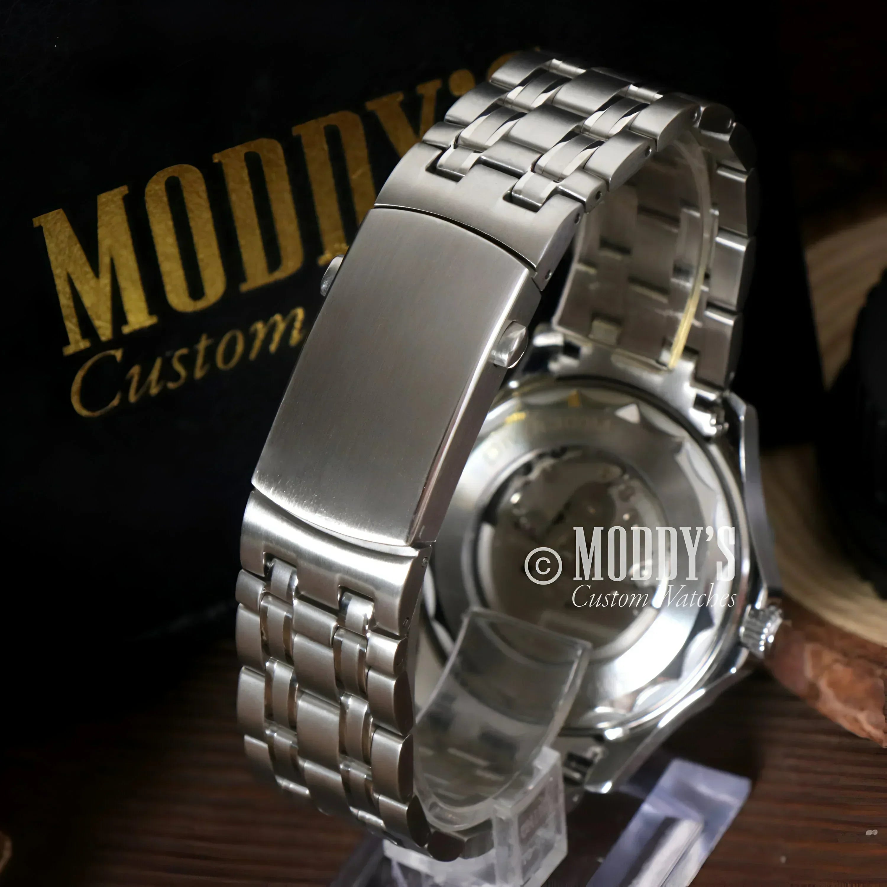 Silver metal watch with visible gears featuring NH35 automatic movement by Seiko Mod Seamaster