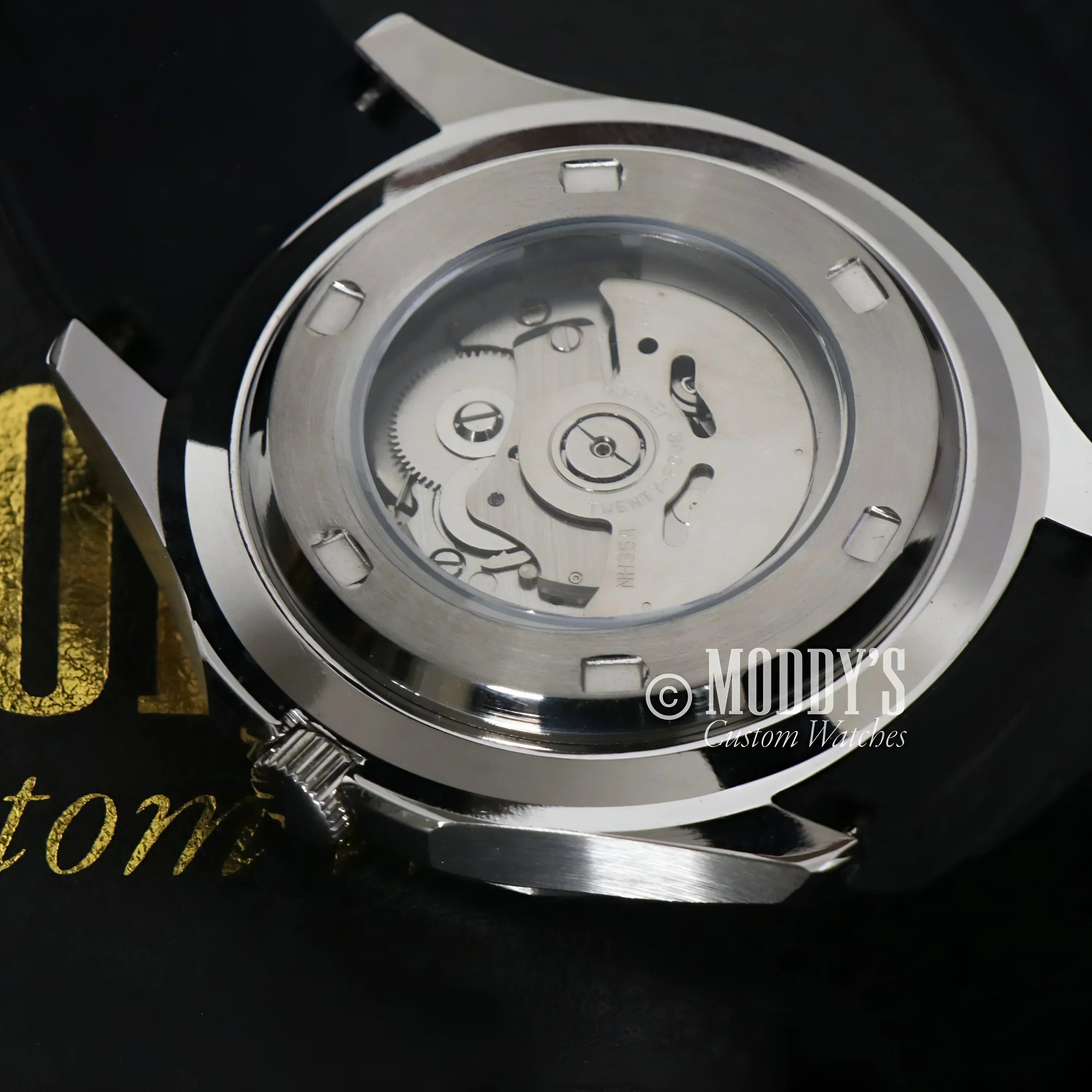 Silver watch case with visible NH35 automatic movement in Seikonaut Black model