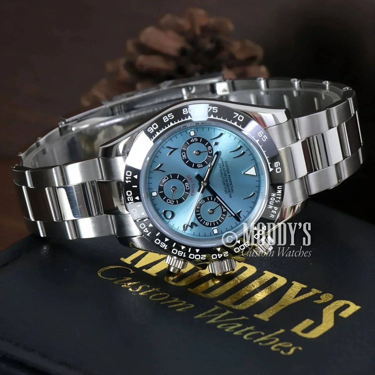Silver wristwatch with blue face featuring Seiko VK63 hybrid movement, Arabic Ice Blue style