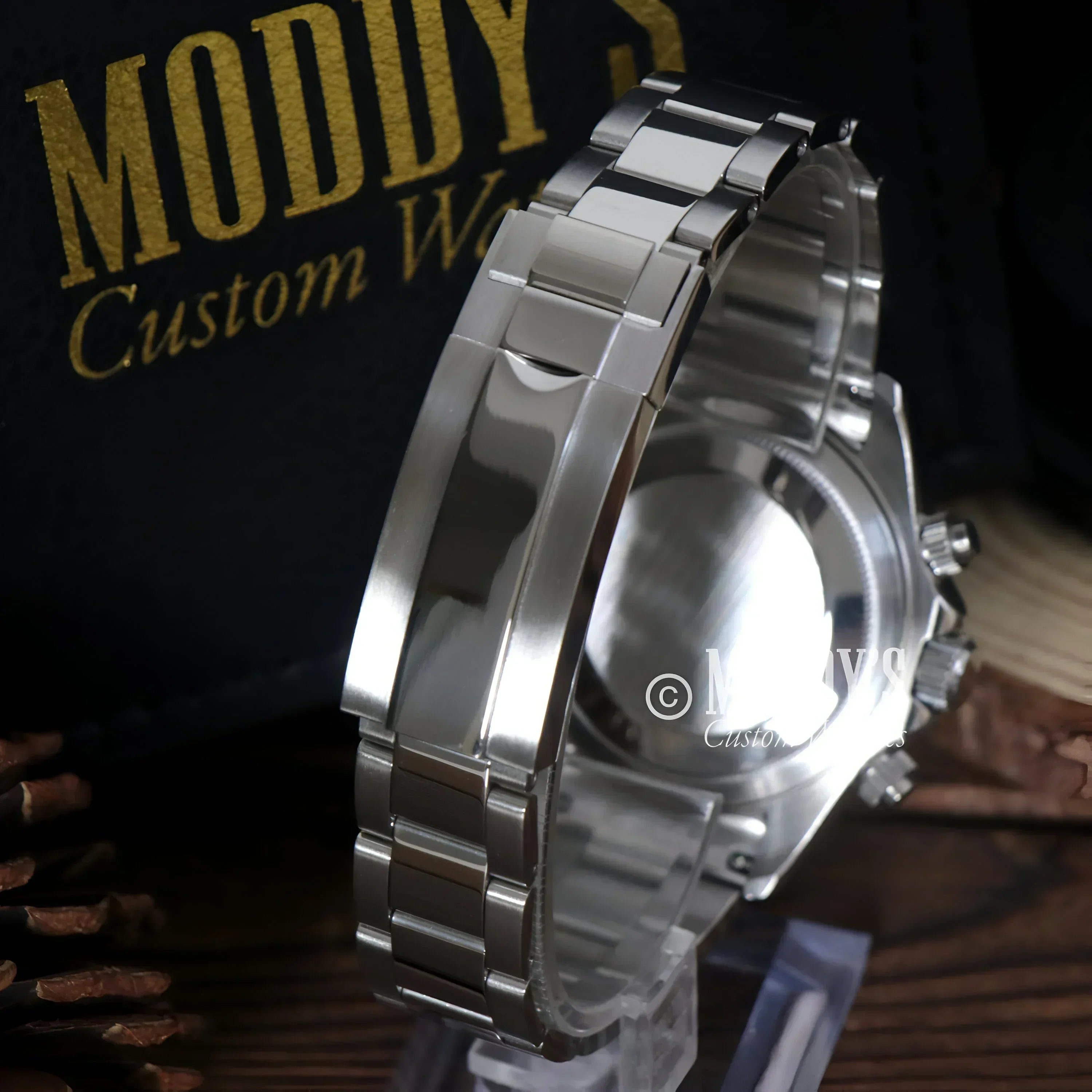 Silver wristwatch with metal band featuring Seiko VK63 hybrid movement and Arabic Ice Blue