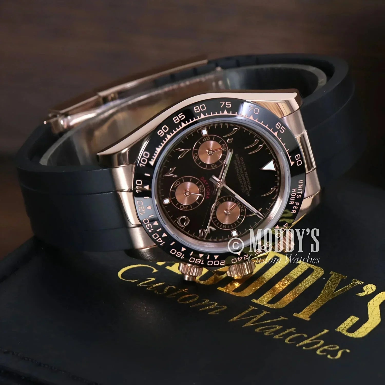 Rose gold chronograph wristwatch with black rubber strap featuring VK63 hybrid movement