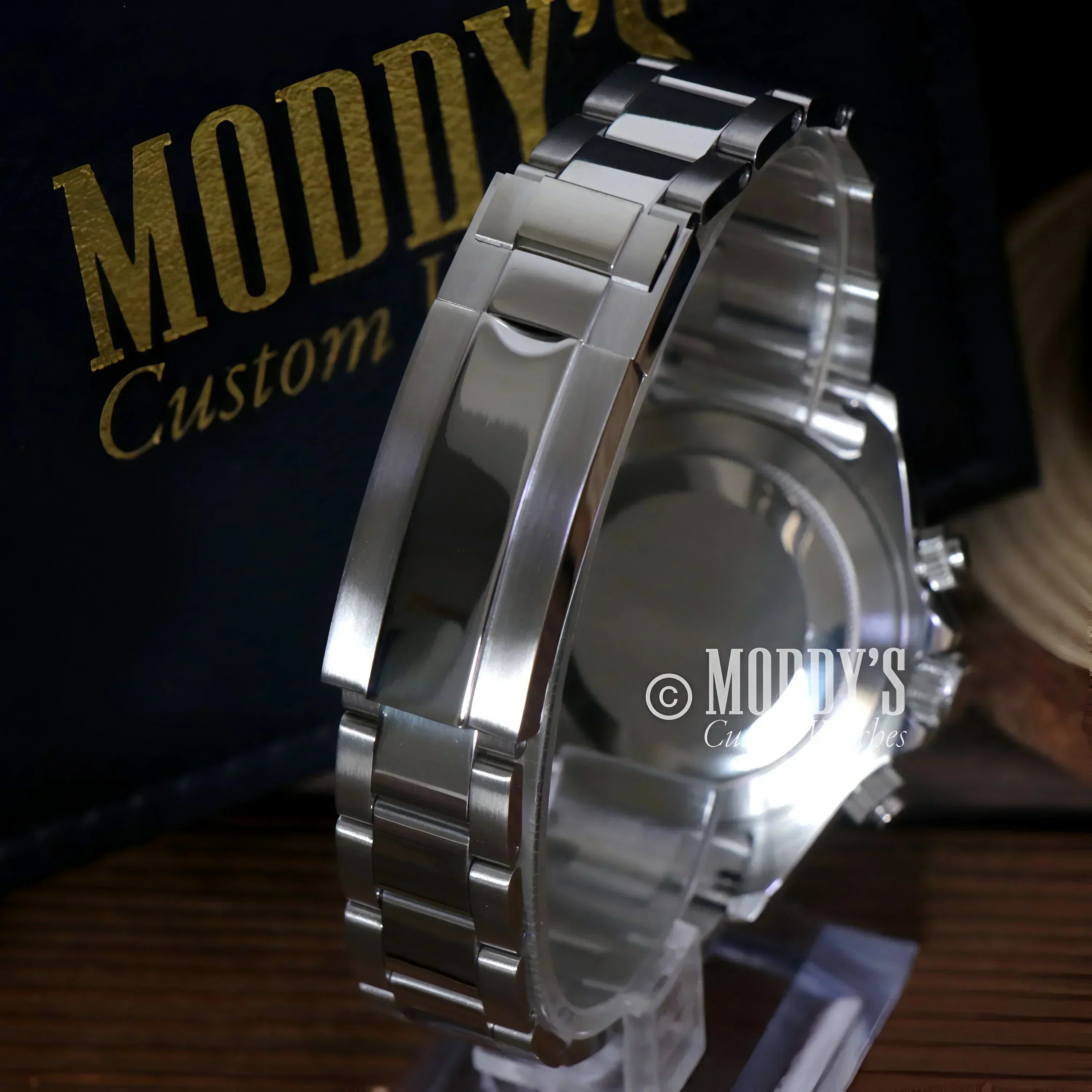 Silver wristwatch with metal band featuring Seiko VK63 hybrid movement in Arabic Royal Blue