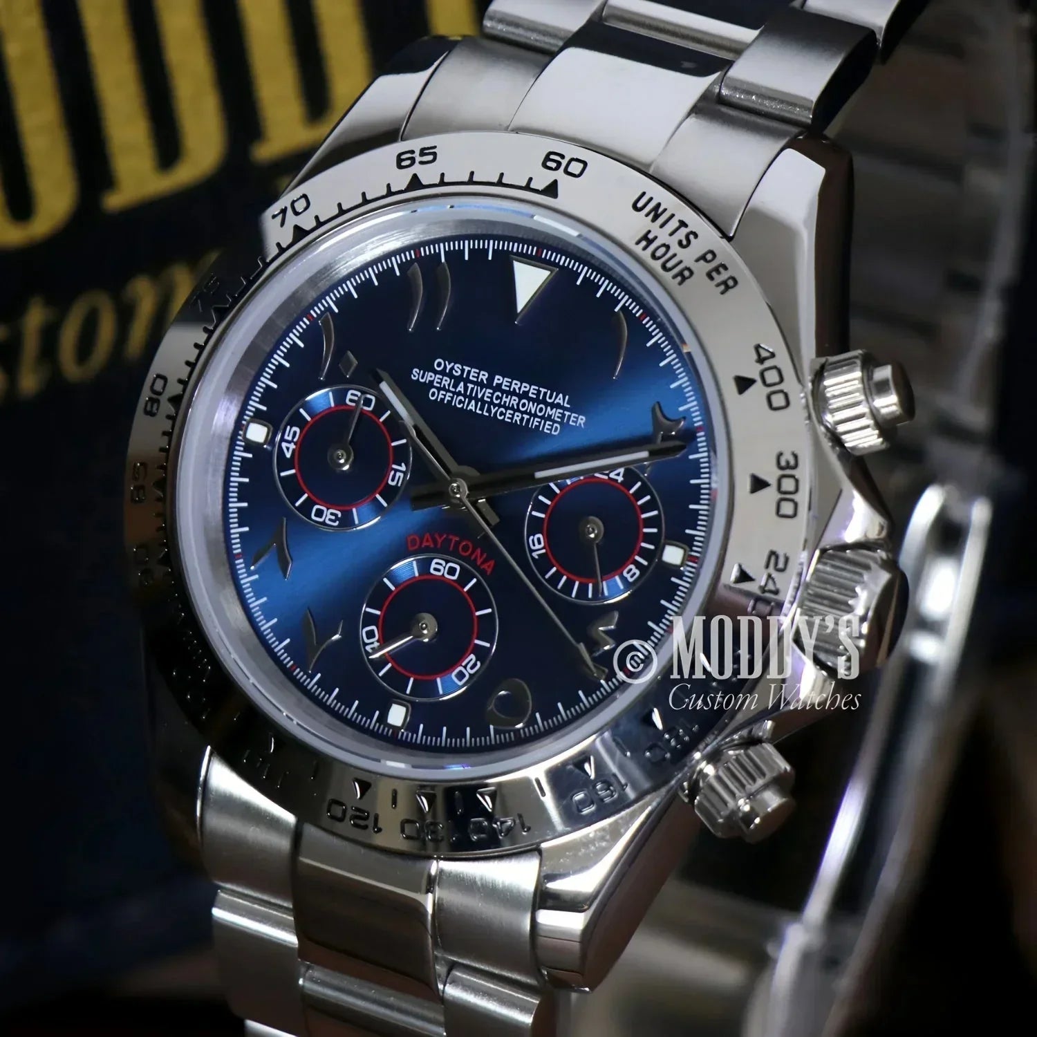 Silver Rolex Daytona with Arabic Royal Blue face featuring VK63 hybrid movement