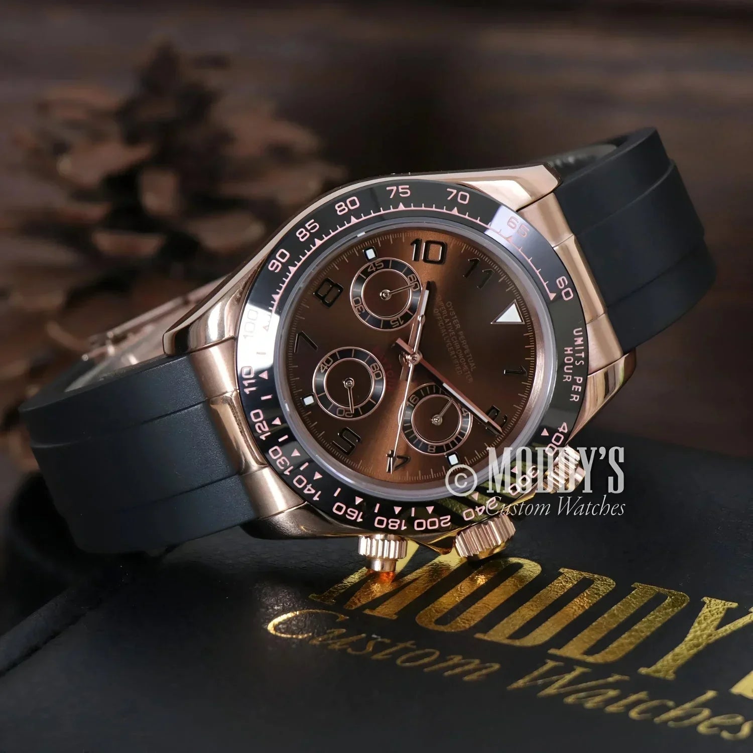 Rose gold chronograph wristwatch with black band, featuring Seiko VK63 hybrid movement