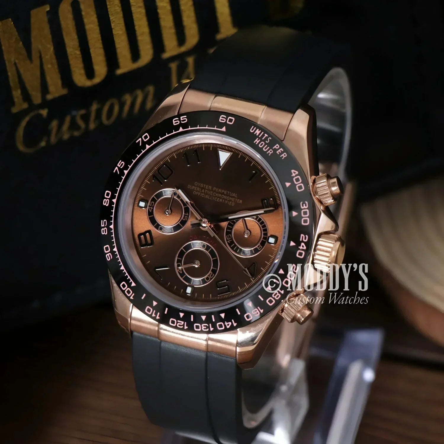 Rose gold chronograph wristwatch with black band, featuring Seiko VK63 hybrid movement