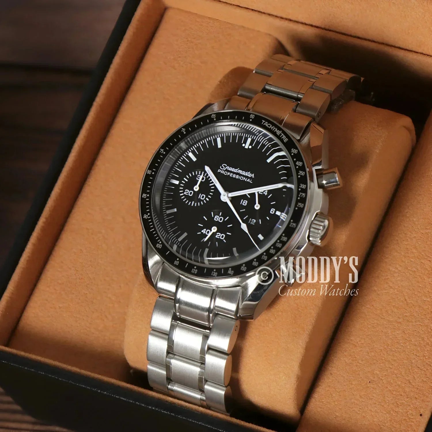 Silver Omega Speedmaster wristwatch featured in Seiko Mod Speedmaster with VK63 hybrid movement
