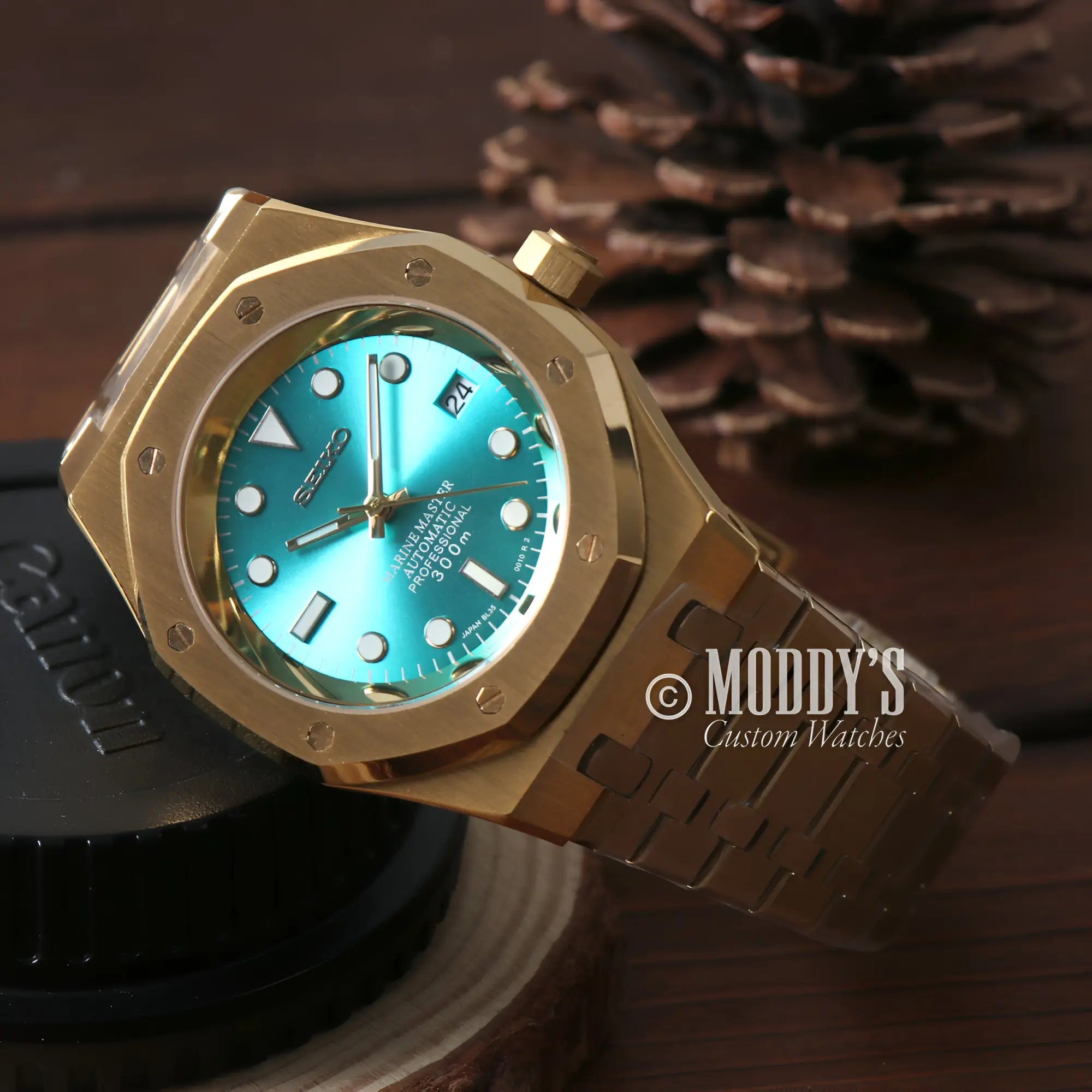 Gold-toned Seiko mod automatic watch with turquoise dial for enthusiasts unique style