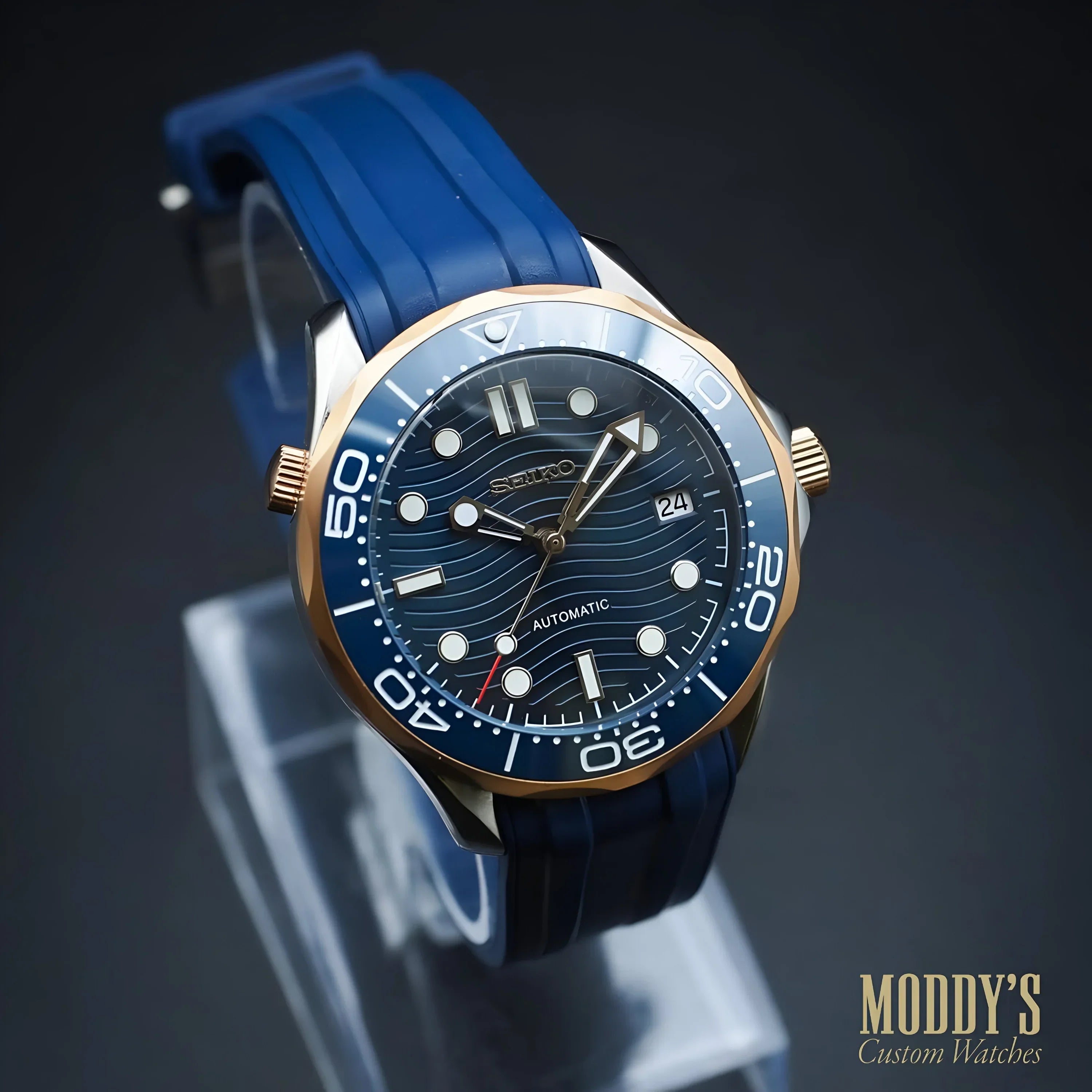 Seiko mod diver’s watch with blue dial, gold bezel, royal blue strap, elegance fused