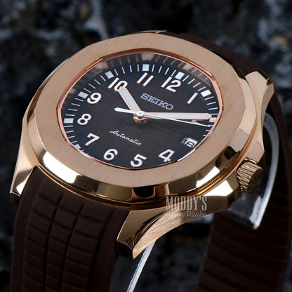 Rose gold Seiko mod Aquanaut watch with black dial and brown rubber strap