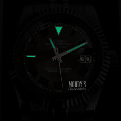 Seiko Prospex NH35 automatic watch with black dial and green lume