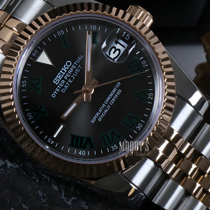 Two-tone Seiko NH35 automatic watch with black dial and green Roman numerals