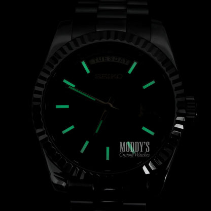Seiko mod black luminous watch with green hands, 316L stainless steel band
