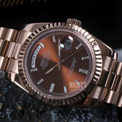 Rose gold Seiko mod watch with brown gradient dial and date window
