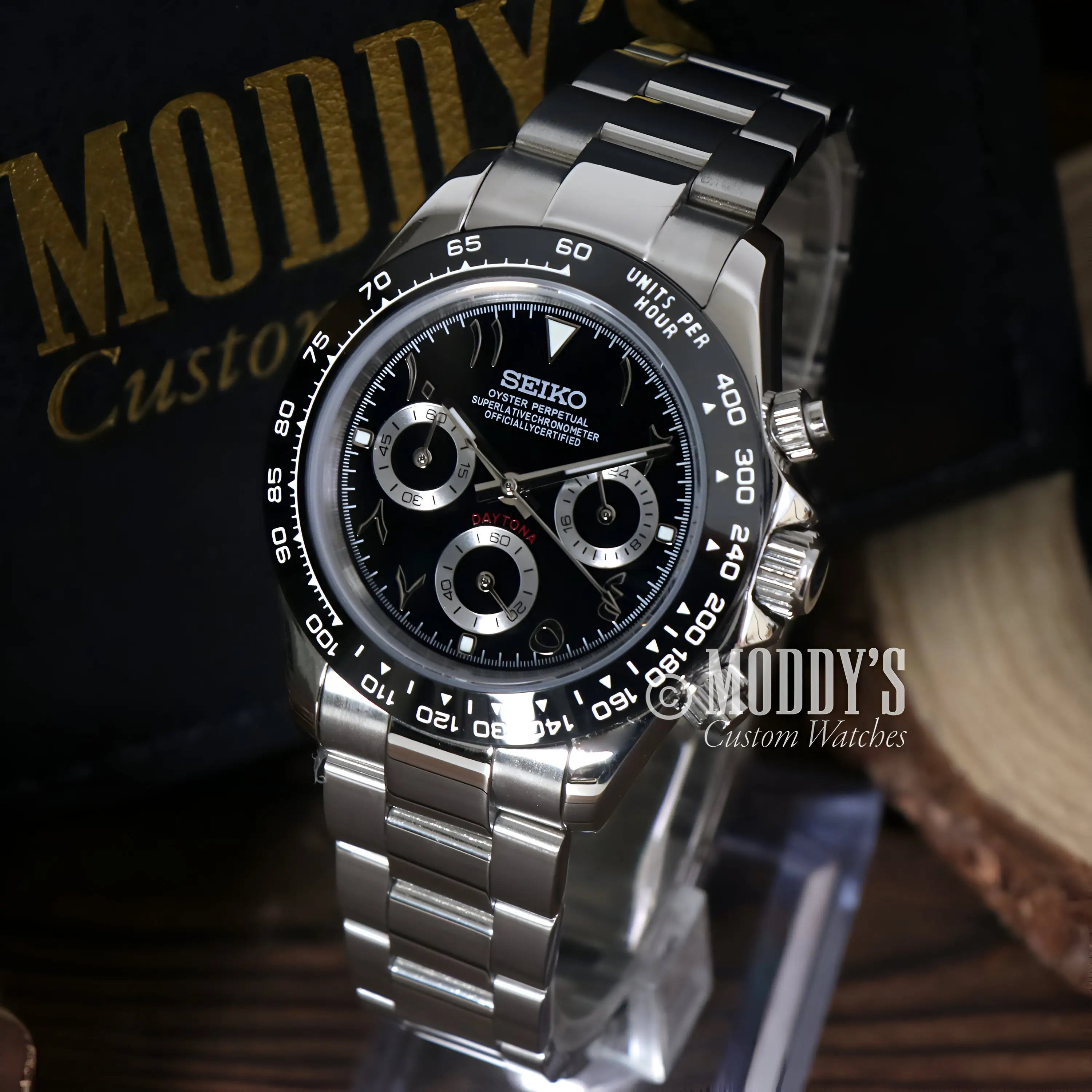 Seiko VK63 hybrid chronograph watch with black dial and silver steel bracelet, water resistance