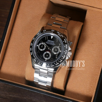 Seiko VK63 hybrid chronograph watch with black face and brown wooden band, water resistance