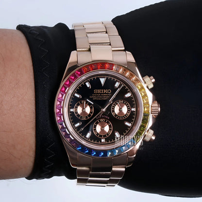 Rose gold Seiko chronograph watch with black dial and rainbow bezel, Seitona model featuring VK63 hybrid movement