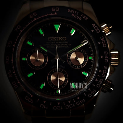 Seiko VK63 hybrid chronograph watch with black dial and green luminous markers