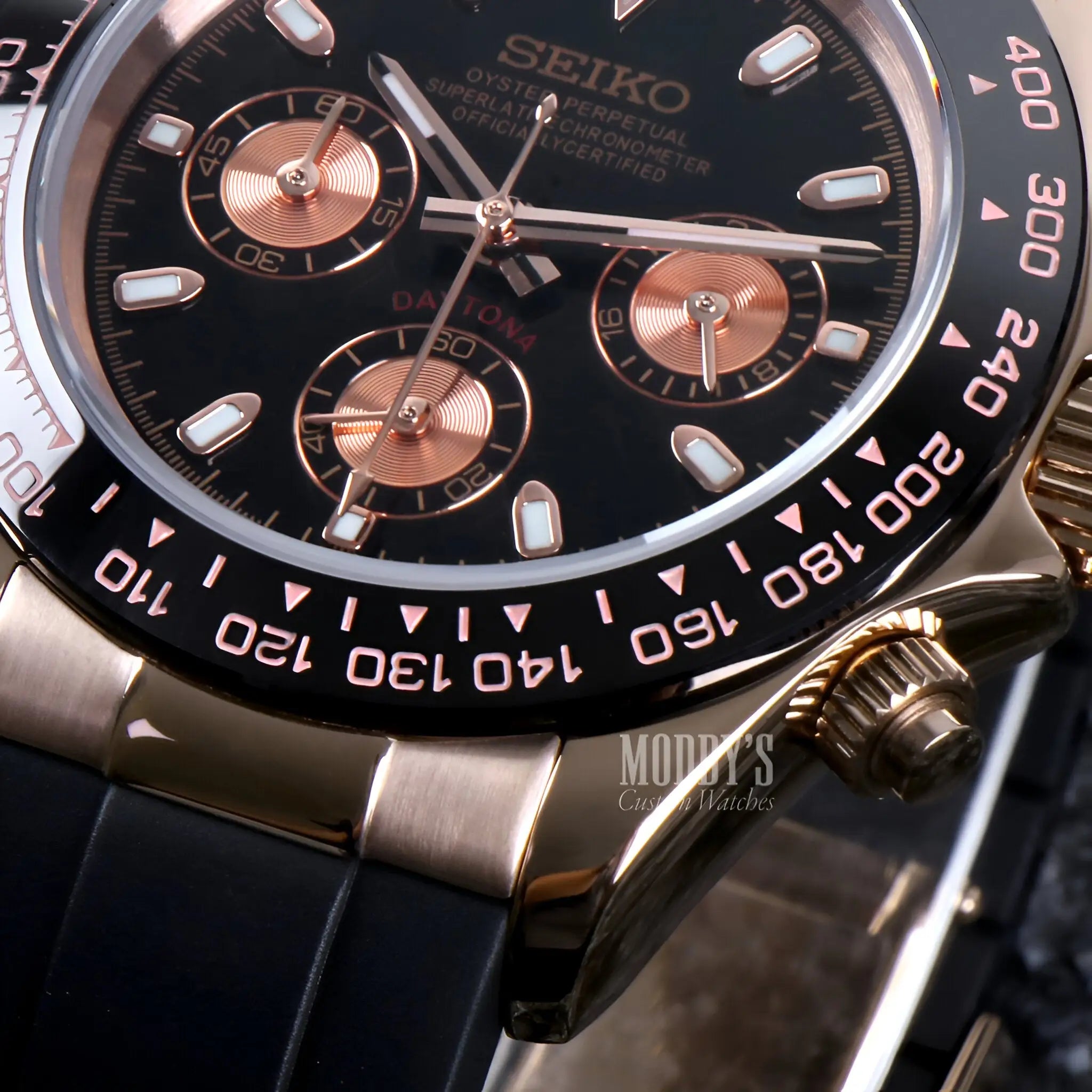Seiko VK63 hybrid chronograph watch with black dial, rose gold accents