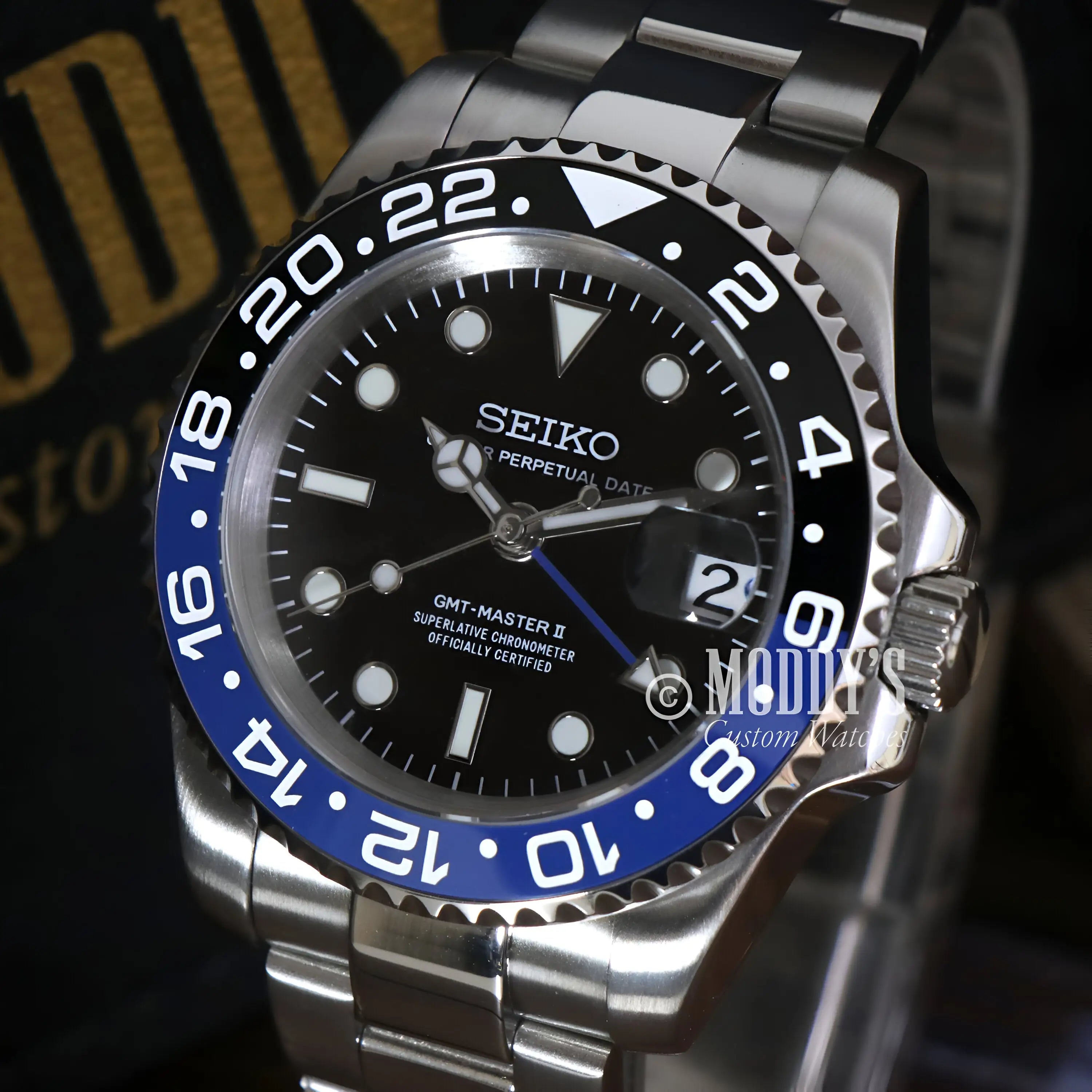 Seiko NH34 mod GMT Batman watch with black dial, blue white bezel