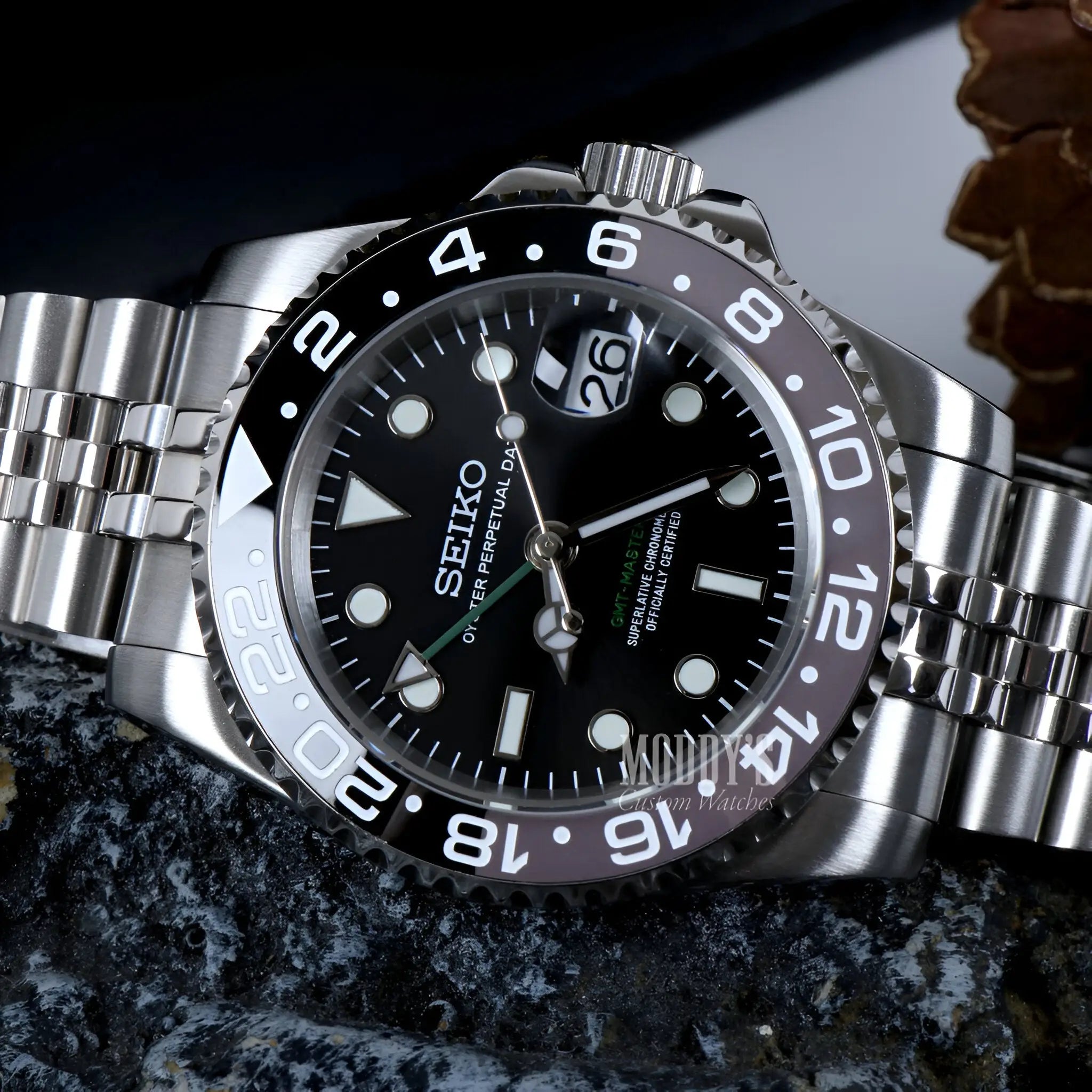 Seiko NH34 automatic GMT mod watch with black dial and silver bezel