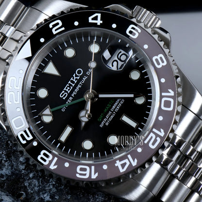 Seiko NH34 automatic mod GMT watch with black dial and green hands