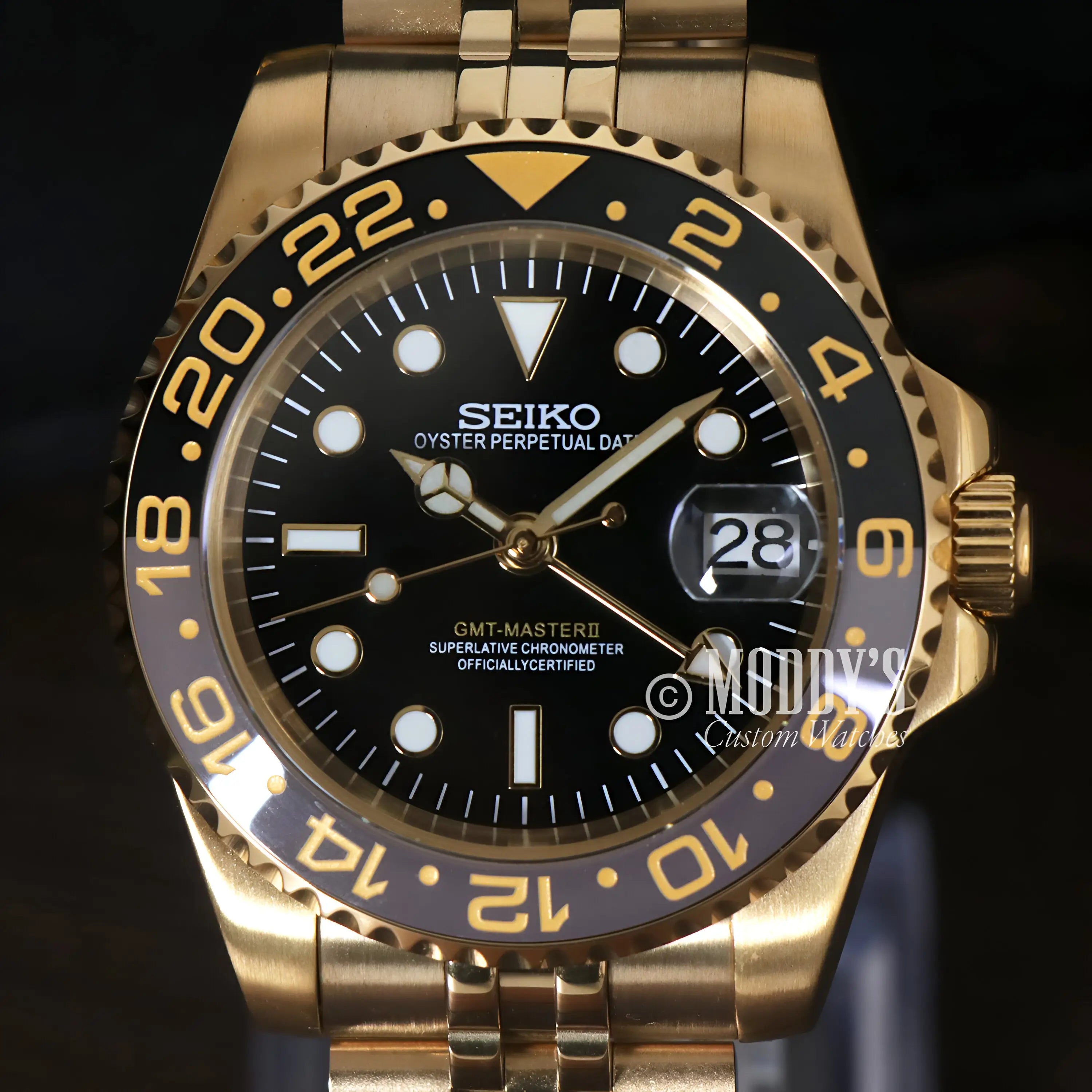 Gold Seiko Mod GMT watch with NH34 automatic movement, black dial, bezel, date window