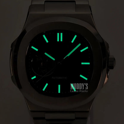 Green glow-in-the-dark Seiko mod Nautilus watch with black open movement