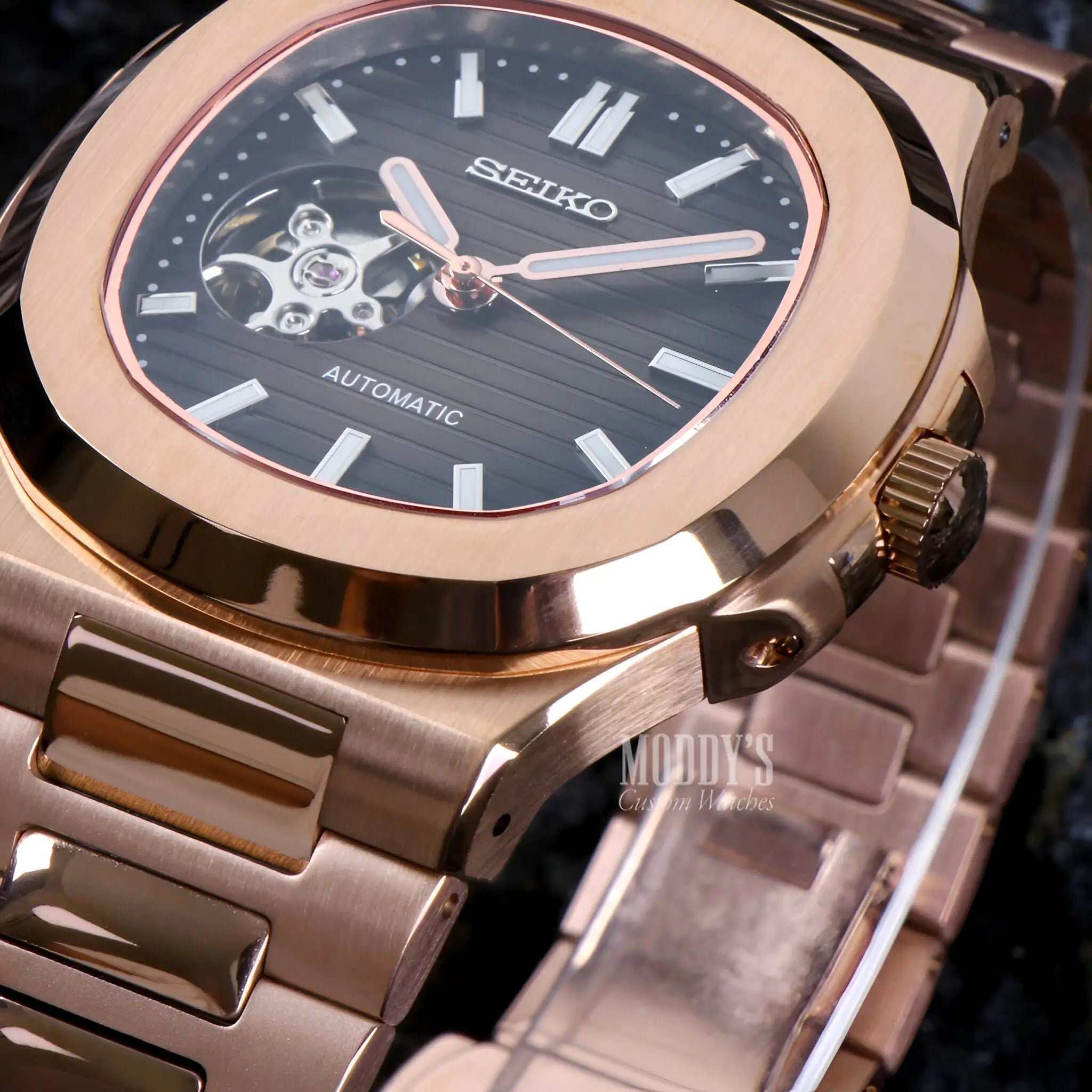 Rose gold Seiko mod Nautilus watch with NH38 movement and black open heart dial