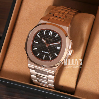 Rose gold black Nautilus watch with black dial and date window