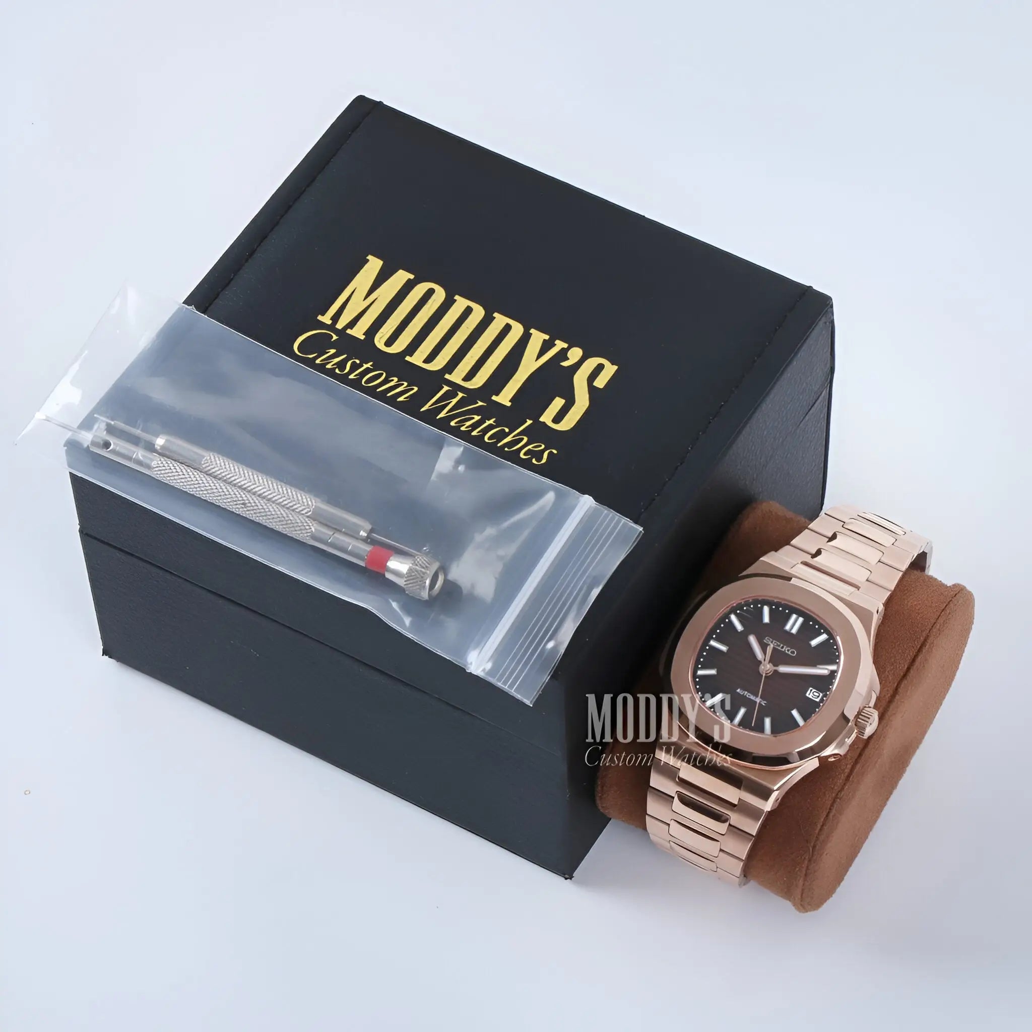 Rose gold Patek Philippe Nautilus watch with black dial and Seiko NH35 automatic mod