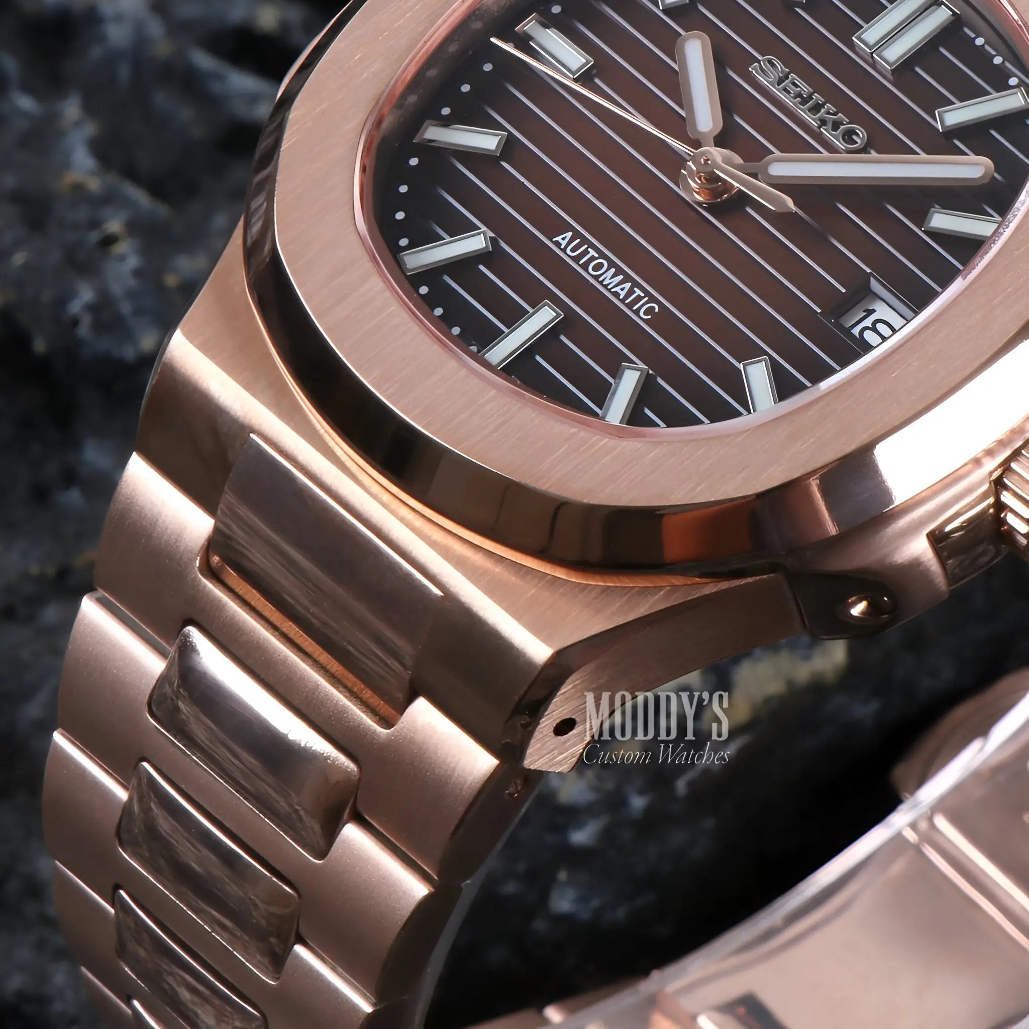 Rose gold Seiko NH35 automatic watch with black dial and silver accents