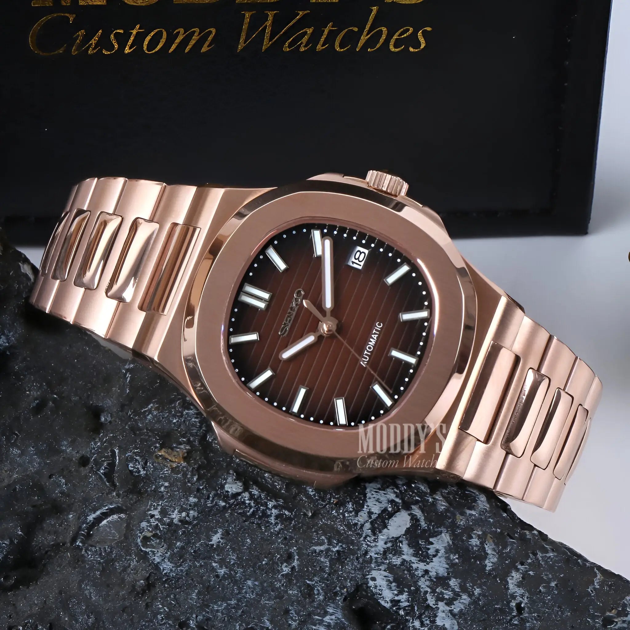 Rose gold Patek Philippe Nautilus watch with brown dial and Seiko NH35 automatic mod