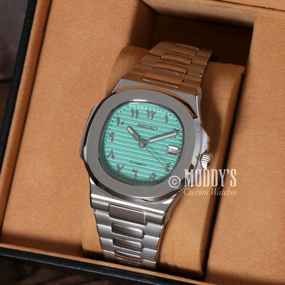 Green Seiko mod Nautilus watch in Arabic Tiffany Blue with silver accents