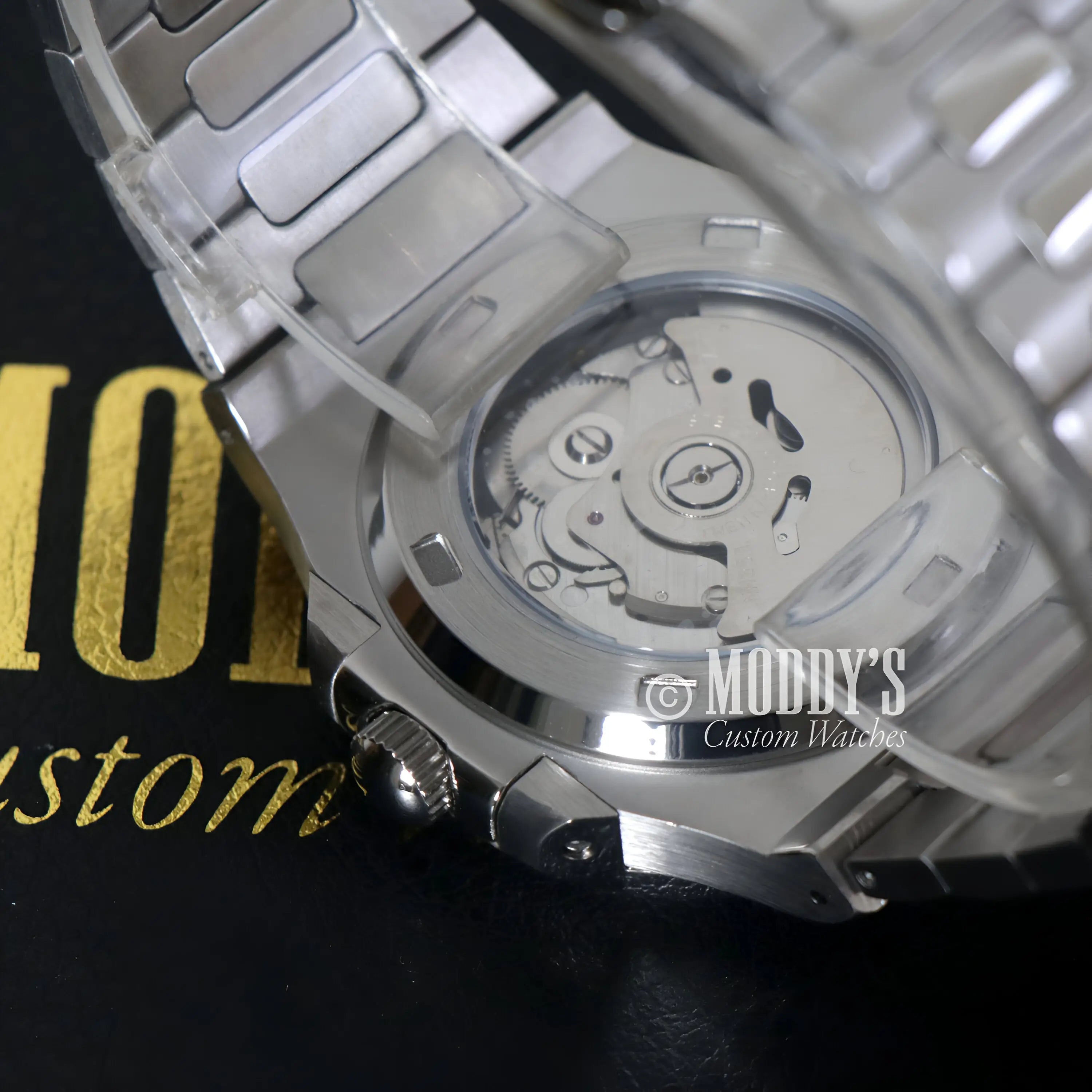 Seiko mod Nautilus watch in Arabic Tiffany Blue with 904L stainless steel case and transparent back revealing Seiko NH35 automatic movement