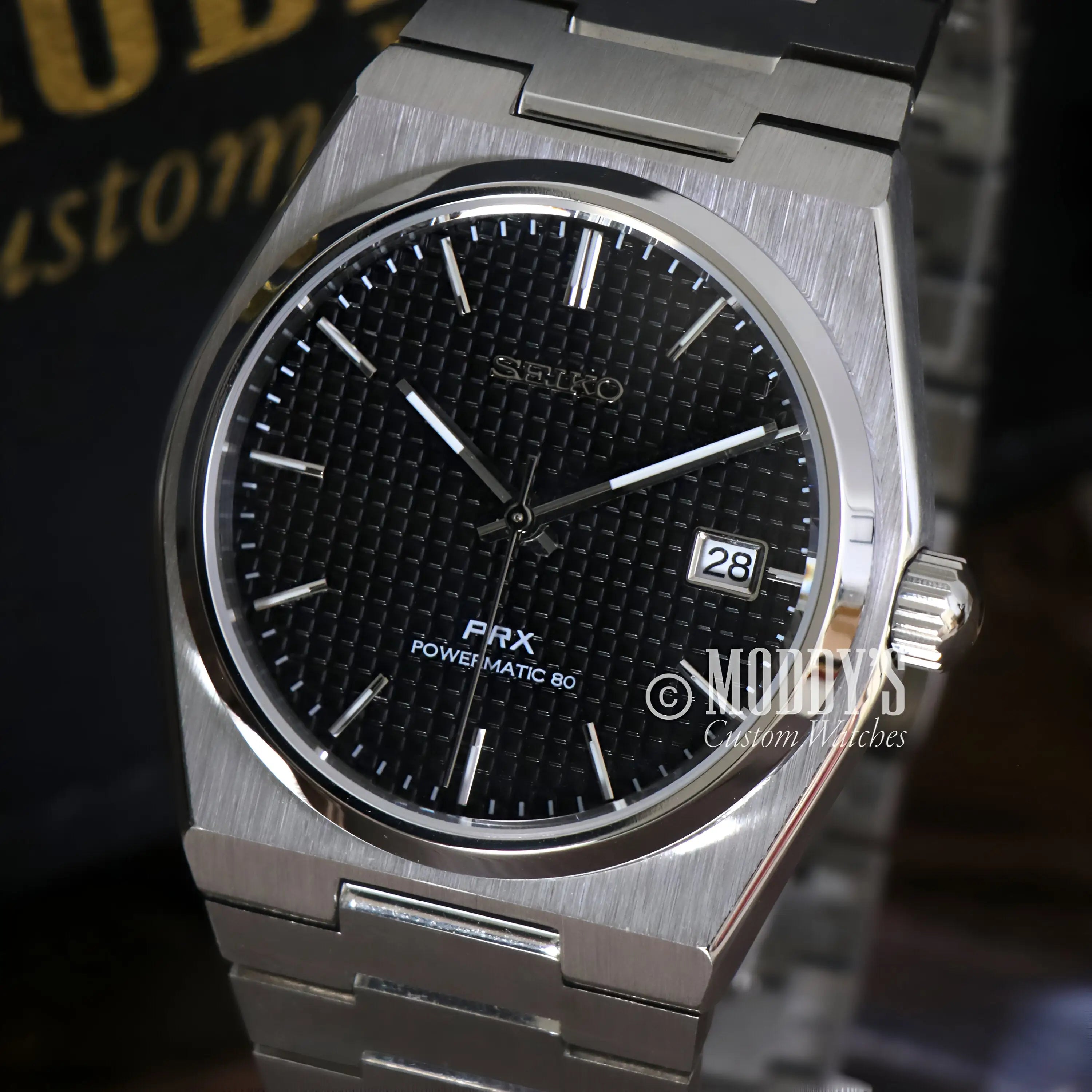 Seiko PRX mod with NH35 automatic movement, black textured dial, silver bracelet