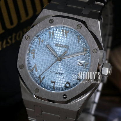 Silver Audemars Piguet Royal Oak mod watch with Seiko NH35 automatic movement, stainless steel bracelet, and textured Arabic ice blue dial