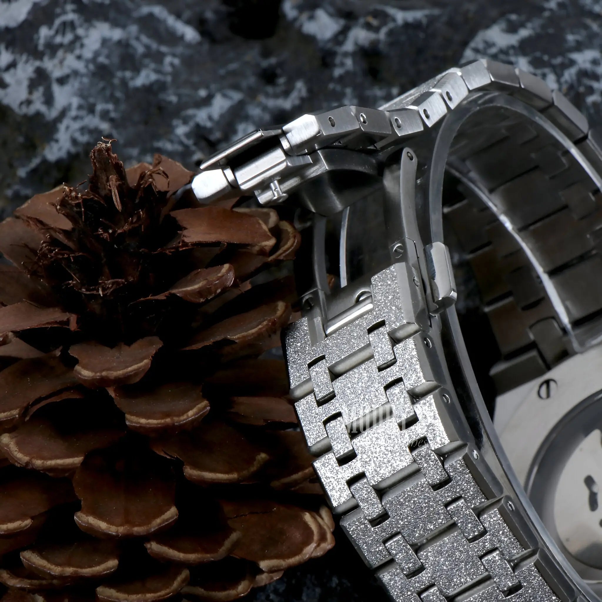 Royal Seikoak White Iced Out watch with Seiko NH35 automatic movement on pinecone background