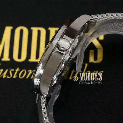 Seiko mod Seamaster watch with silver stainless steel case, textured strap, and push button crown