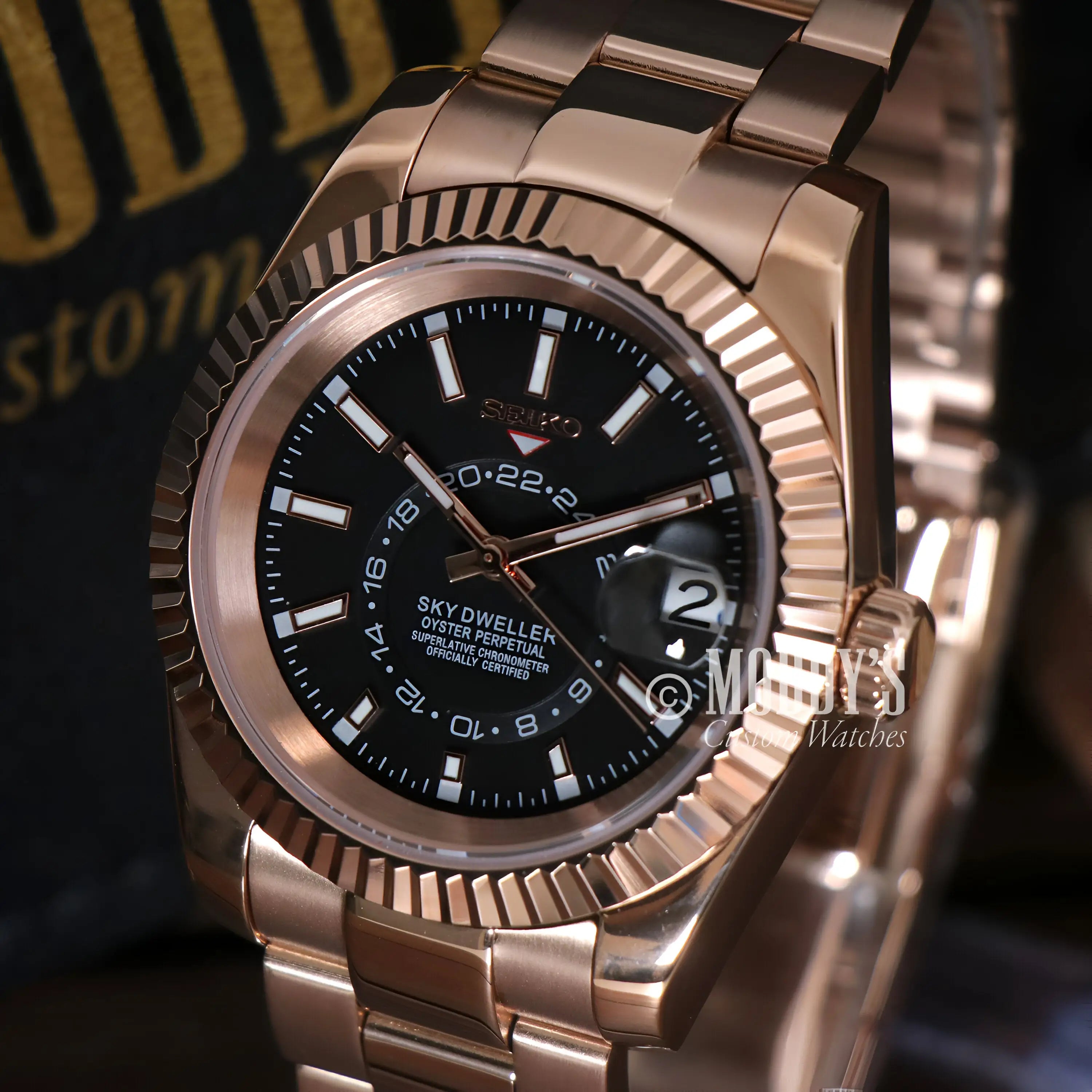 Seikojust Sky Dweller rose gold watch with black dial and silver accents