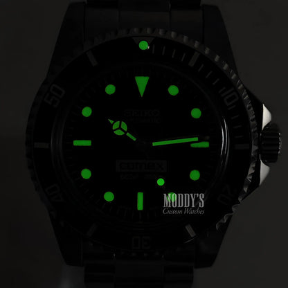 Vintage Seiko mod Submariner watch with black lume and green glow hands