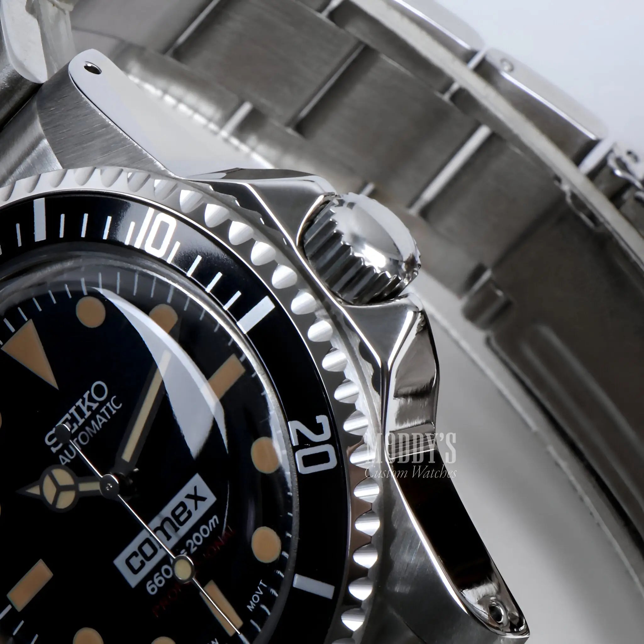Vintage Seiko mod submariner with black dial, gold markers and hands
