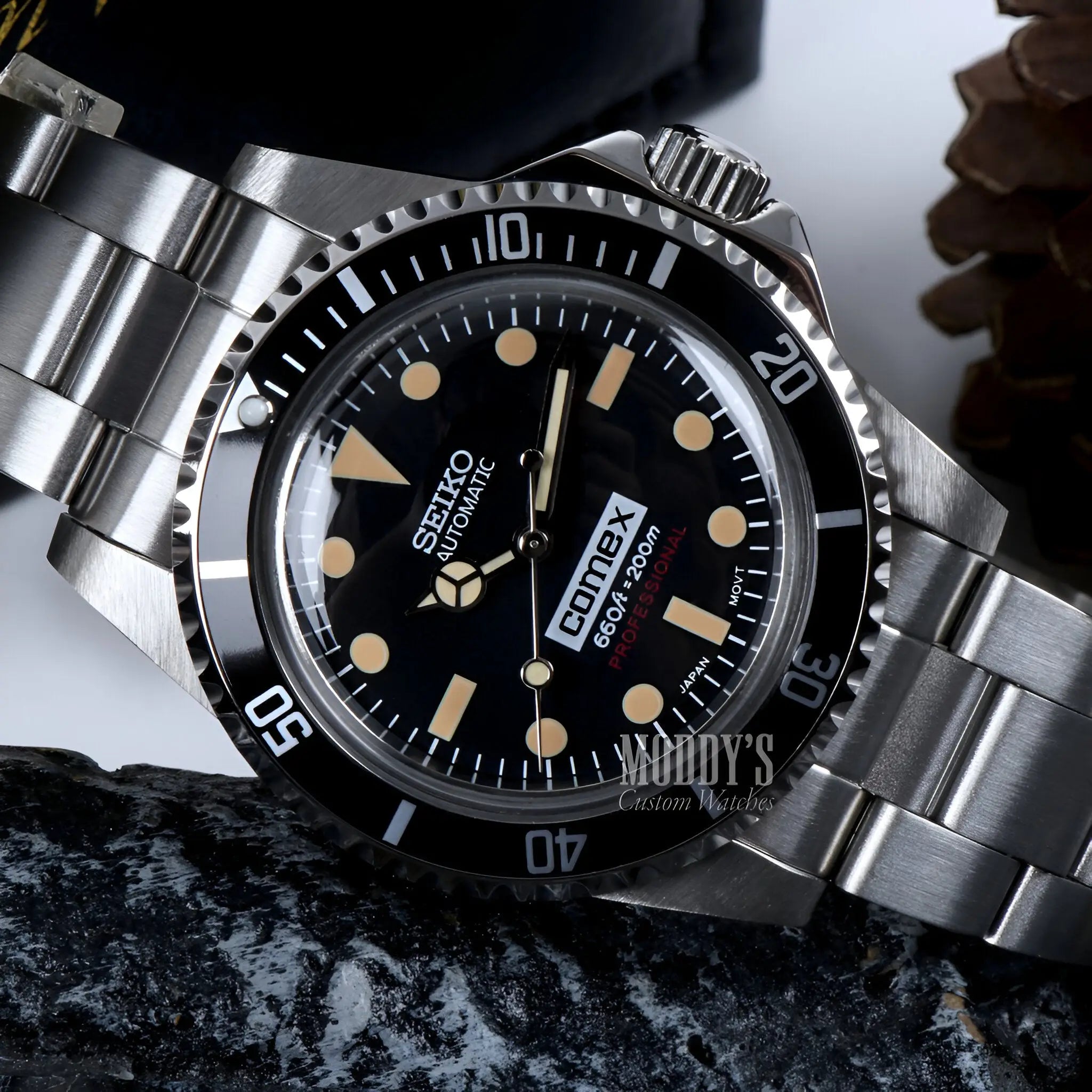 Vintage Seiko mod submariner watch with black dial and luminous hands