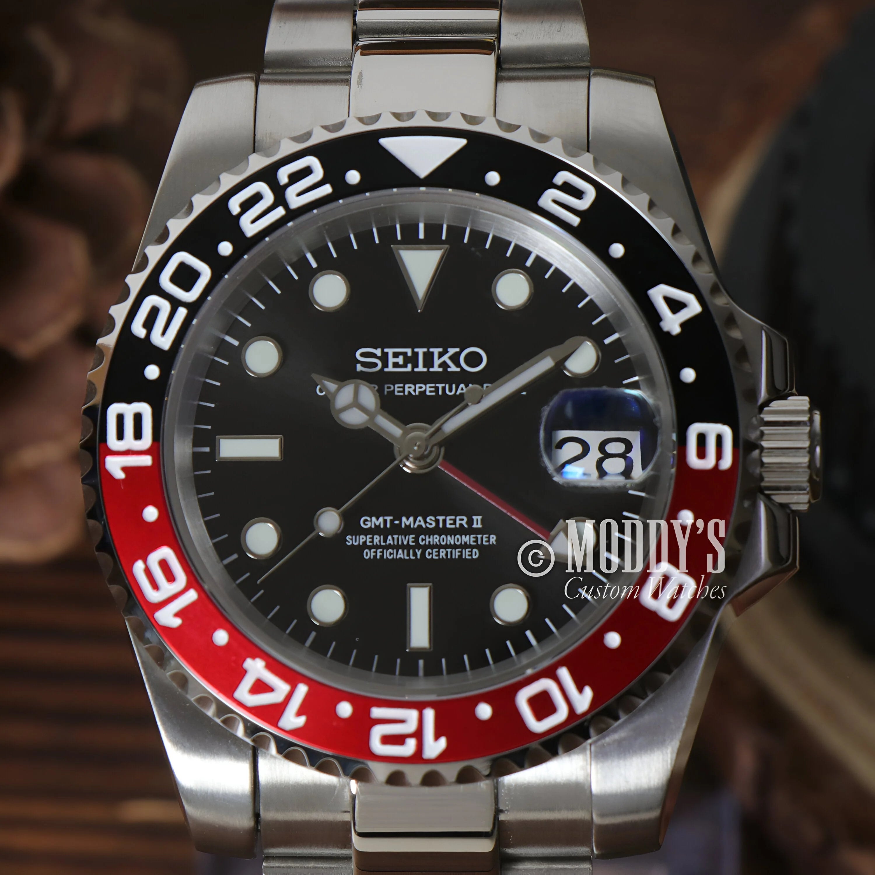 Seiko GMT-Master II watch with black and red Coke bezel in GMTeiko case