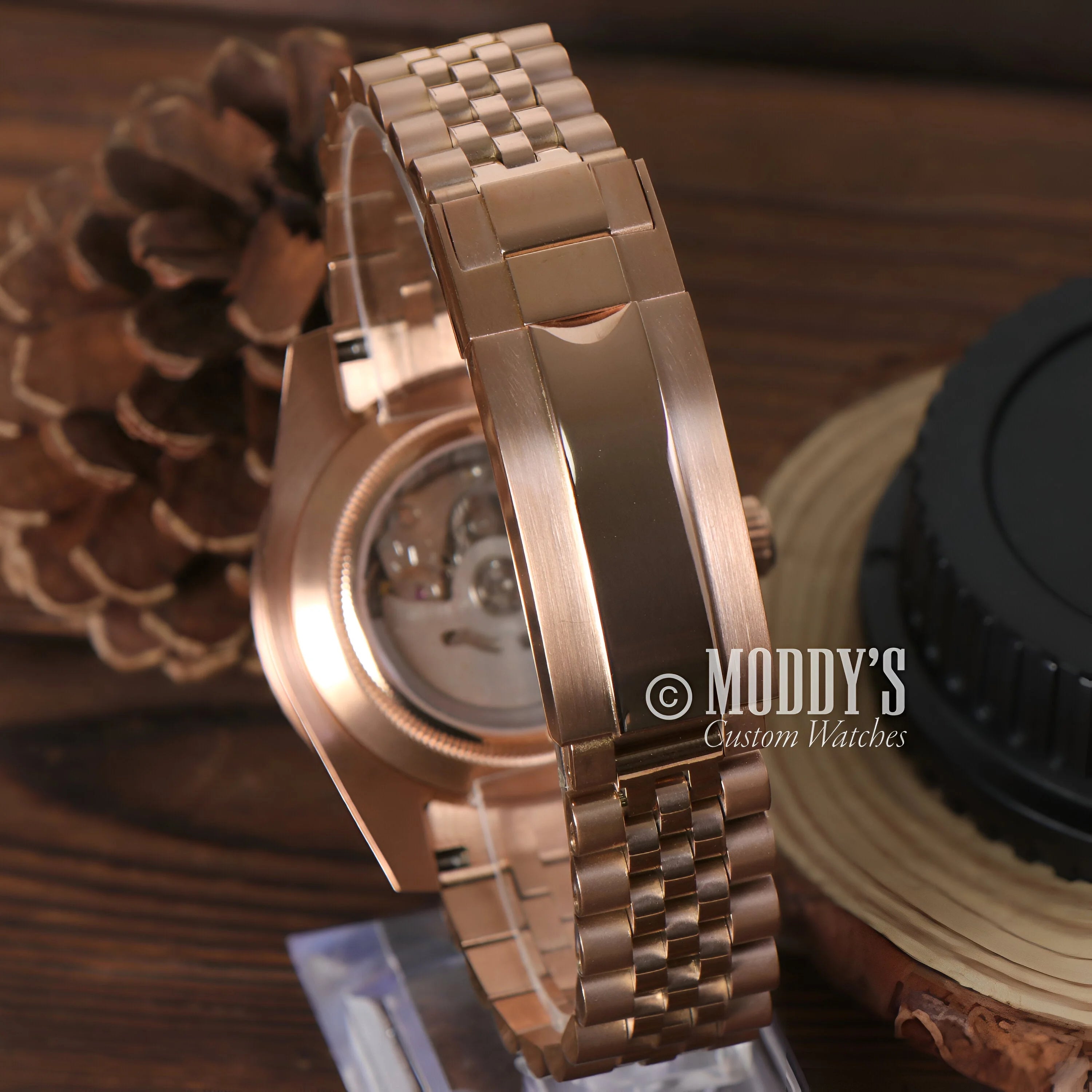 GMTeiko Rose Gold Rootbeer watch featuring a metal link bracelet and elegant case design