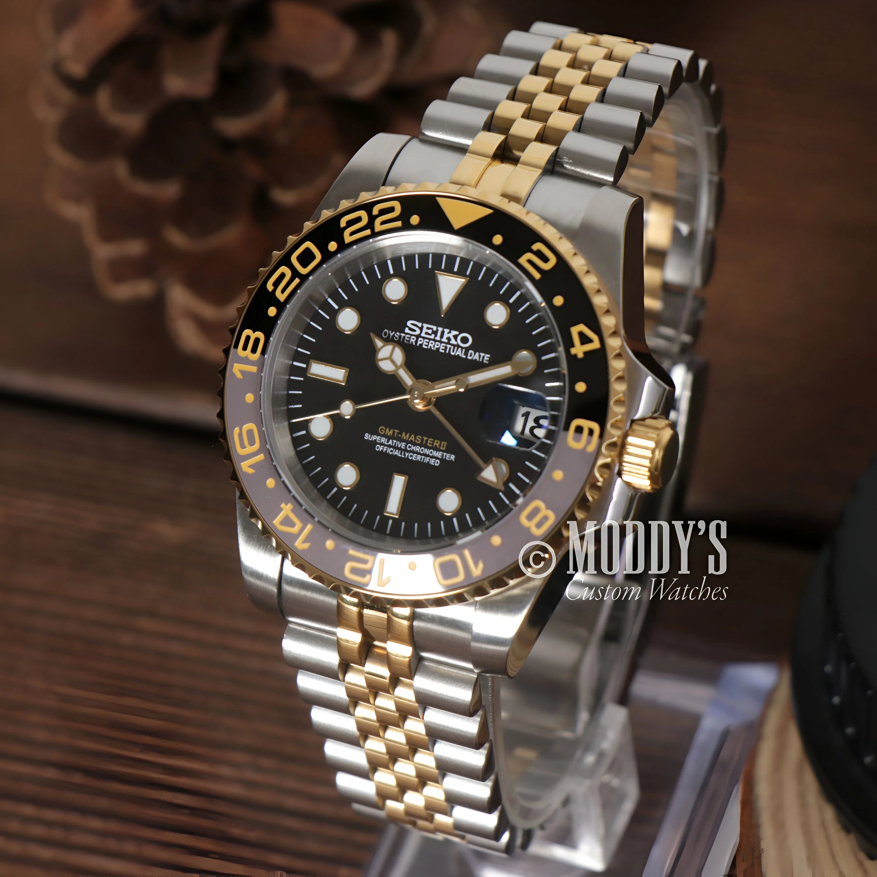 Two-tone 904L Stainless Steel and Gold Seiko dive watch with black dial and rotating bezel