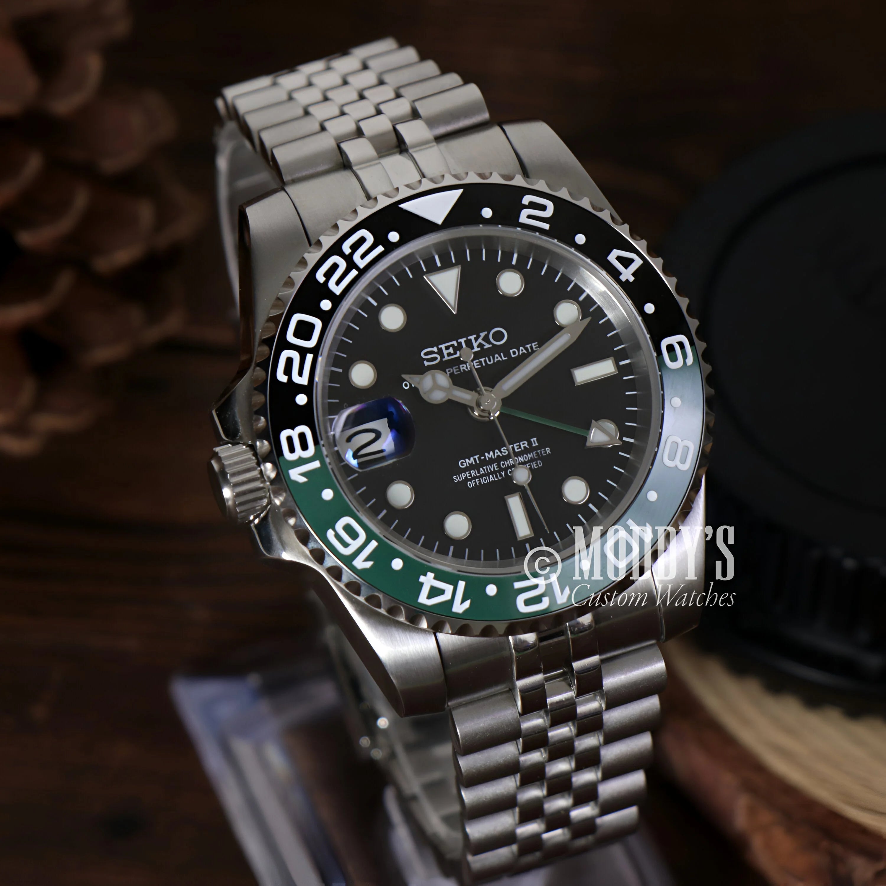 Seiko Mod GMT Sprite with black and green bezel on stainless steel jubilee bracelet