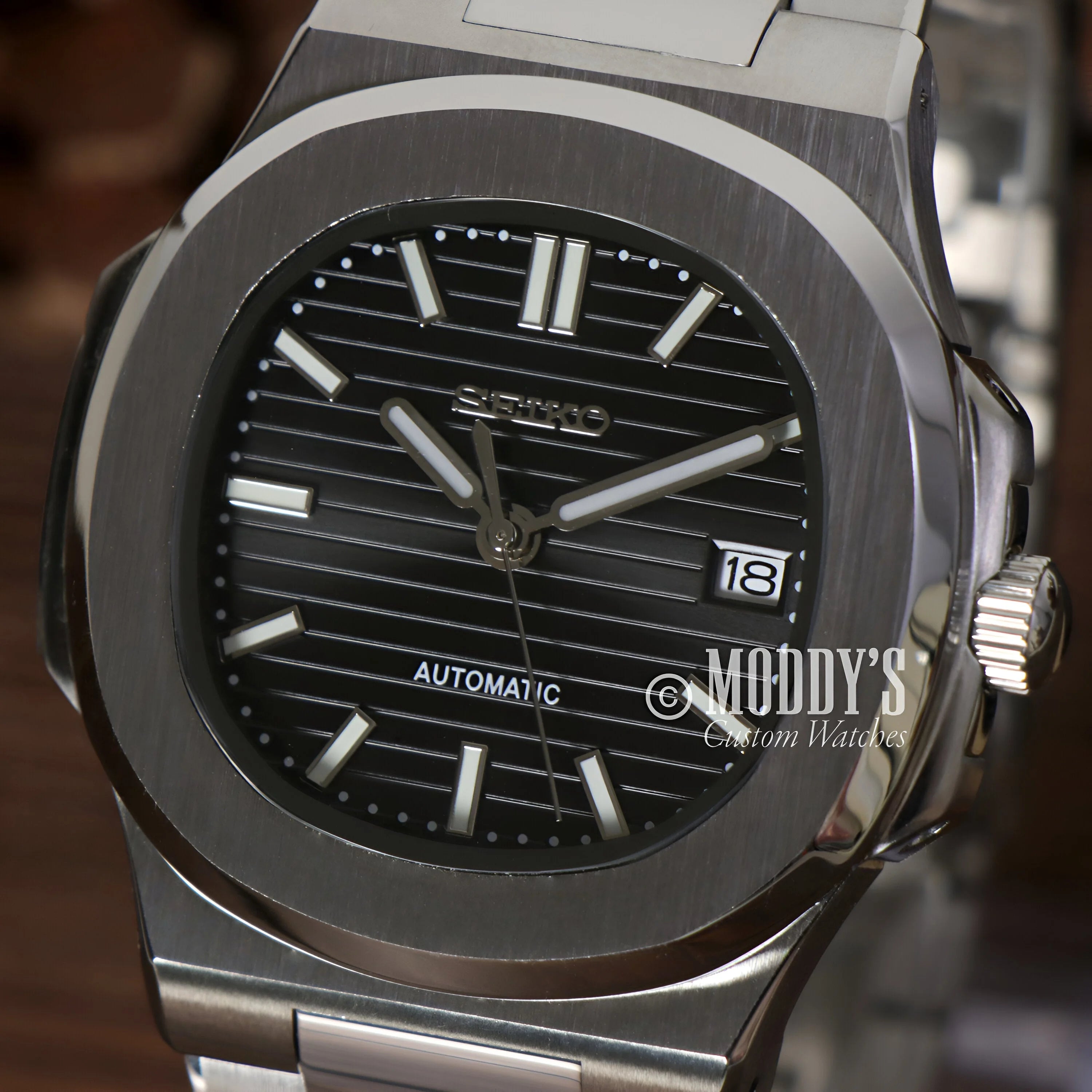 Stainless steel Patek Philippe Nautilus watch in Nautiko Black with striped dial, date window