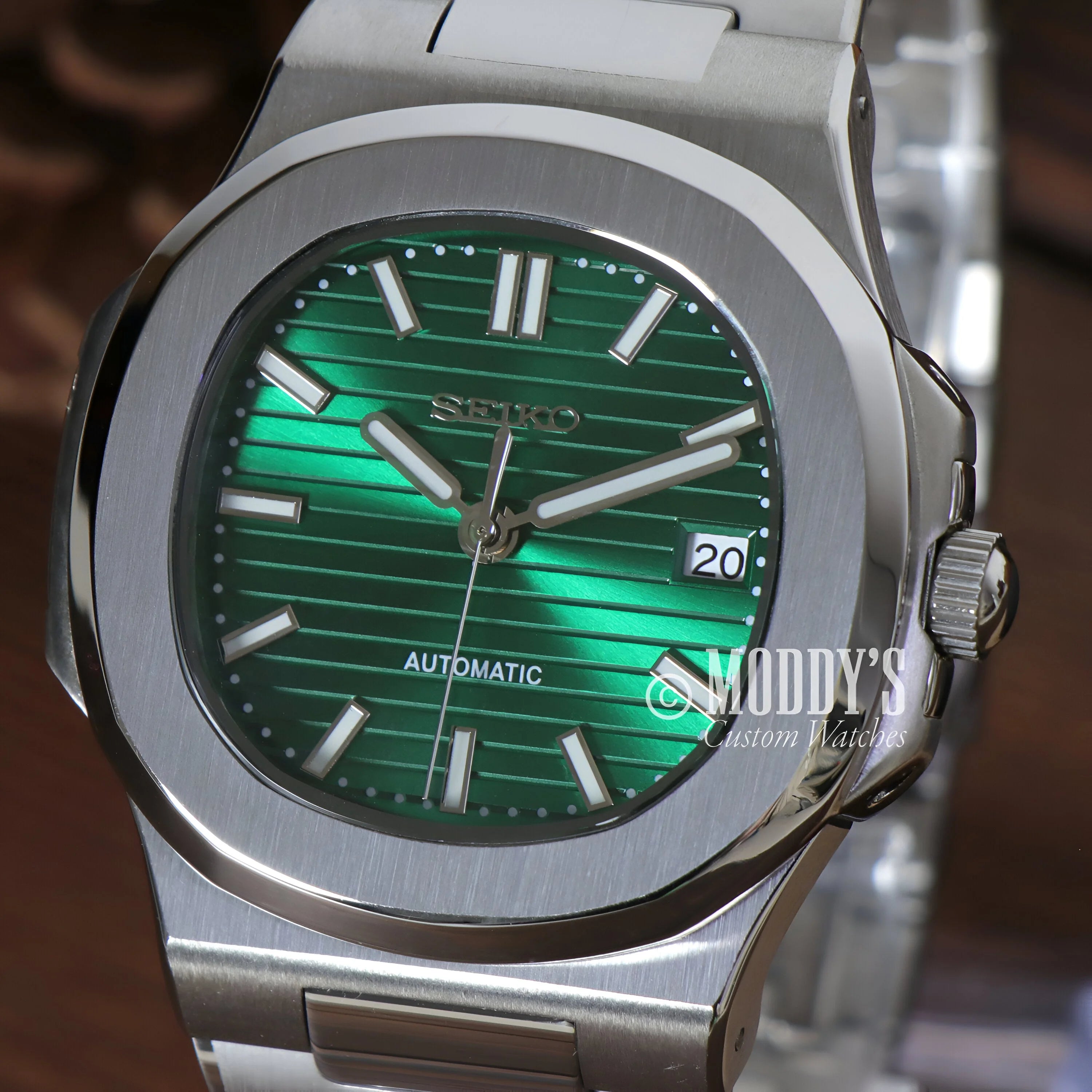 Luxury Nautiko Metallic Green wristwatch with silver case and emerald green dial