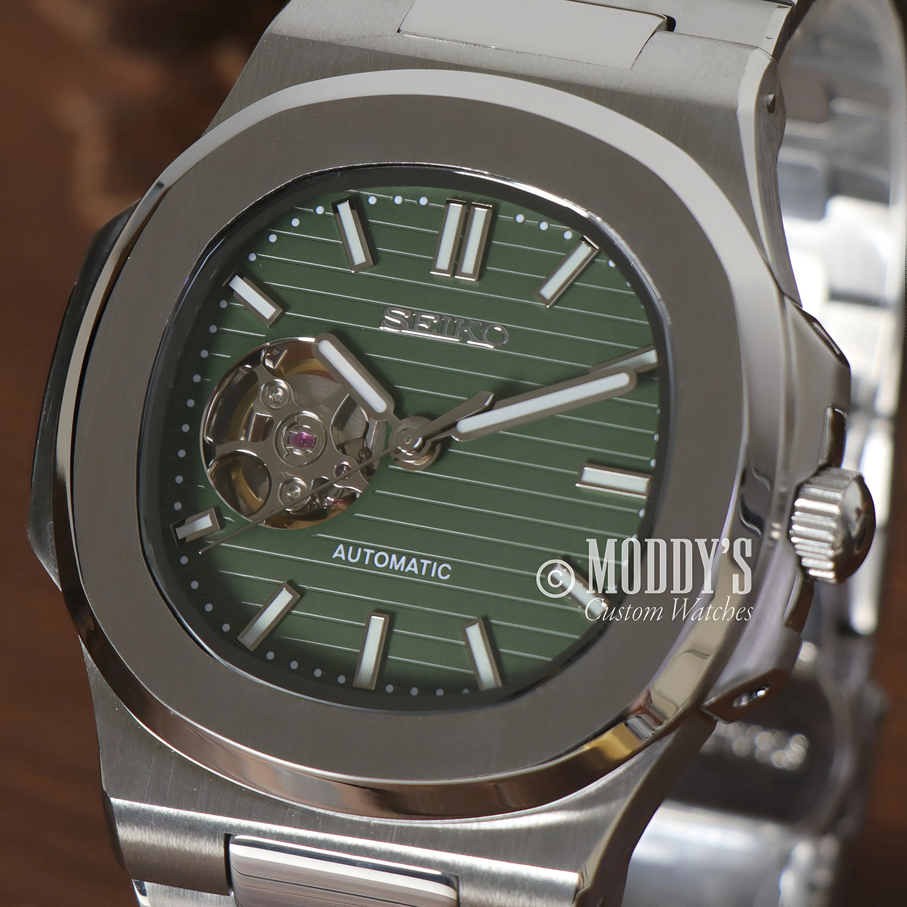 Luxury automatic Nautiko Olive Green Open Movement watch with stainless steel case